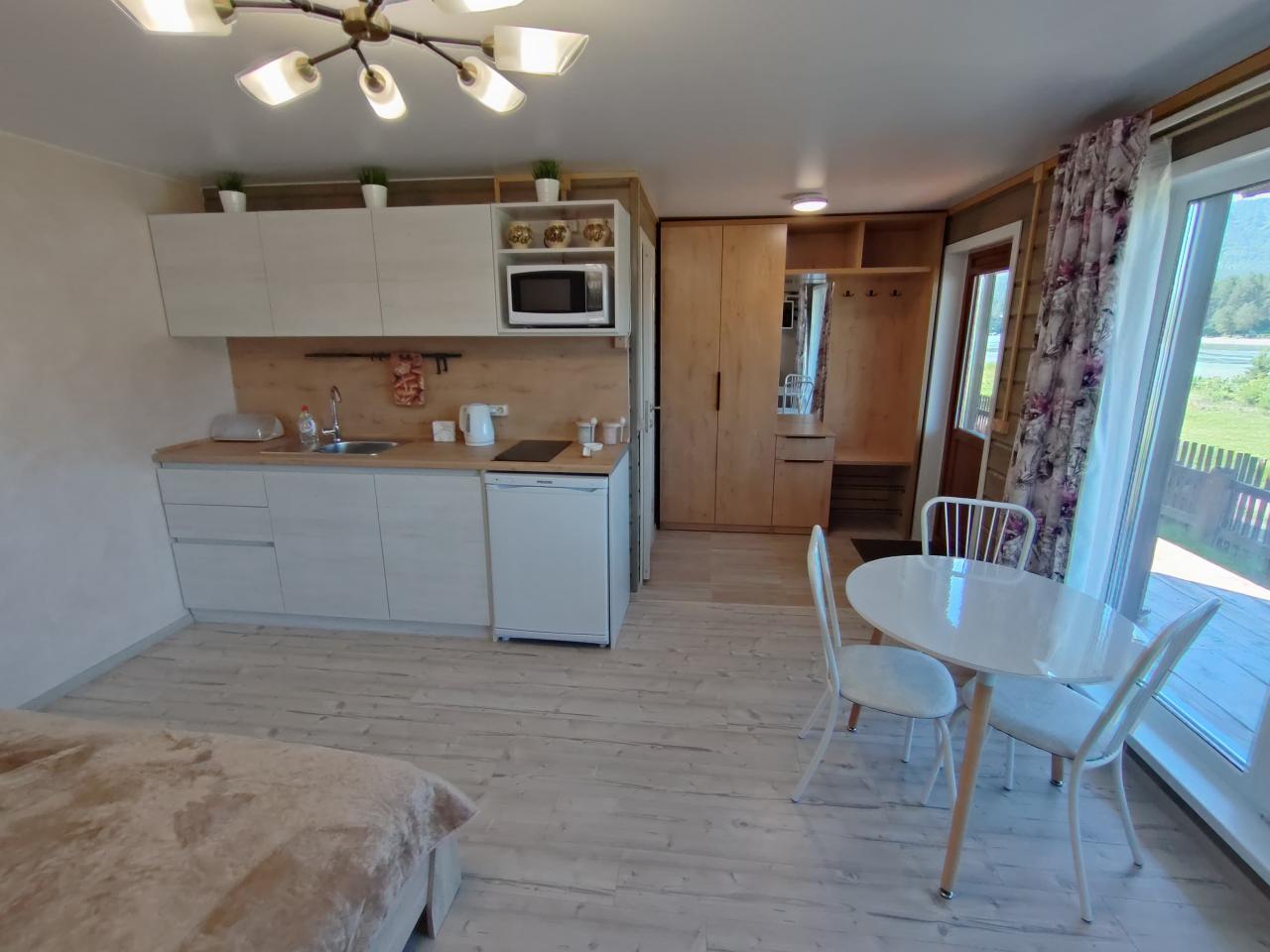 "Дом на берегу" Манжерок Алтай у реки Катунь